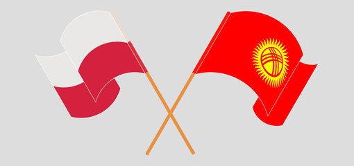 Crossed and waving flags of Poland and Kyrgyzstan