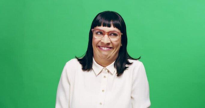 Emoji, woman with funny face and in green screen with background. Comedy or comic entertainment, crazy or weird glasses and geek female person with fun or laughing facial expressions in a chroma key