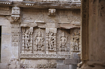 Carved idols on the inner wall and pillars of Rani ki vav, an intricately constructed stepwell on the banks of Saraswati River. Patan in Gujarat, India.
