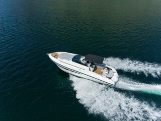 young amazing woman relax on the yacht, aerial view