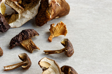 Dried edible forest mushrooms on a table. European cuisine ingredient.