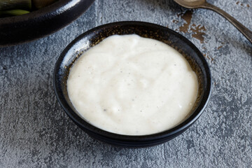 Bechamel sauce in a bowl. Homemade white sauce dip.