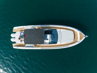 Fototapeta na wymiar young amazing woman relax on the yacht, aerial view