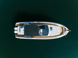 young amazing woman relax on the yacht, aerial view