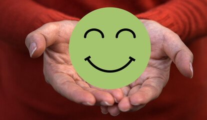 Hand holding paper cut circle symbol face smile, happy, relax, satisfaction survey, customer services, positive, good, wellness, health child, hospital, world mental health day concept