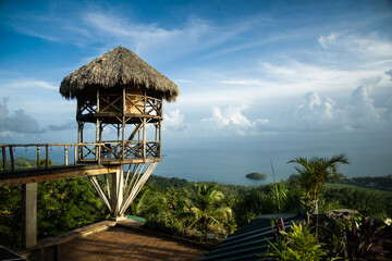 Beautiful viewdeck or gazebo on a hill overlooking a tropical sea in an exotic tourist destination....