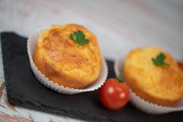 Savory muffin with ham and cheese on blue background, High quality photo