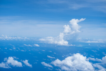 Beautiful cloud view from airplane, sky and clouds from a airplane window, Beautiful view of cumulus clouds with sunny day atmosphere