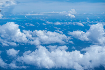 Beautiful cloud view from airplane, sky and clouds from a airplane window, Beautiful view of cumulus clouds with sunny day atmosphere