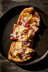 Sliced and served hawaiian mini pizza