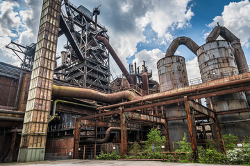 Fototapeta premium Part of the abandoned coal and steel production plant in Landschaftspark Duisburg-Nord. The landscape park Duisburg-Nord is a public park around a disused iron and steel works in Duisburg, Germany.
