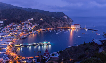 Avalon Harbor at dusk with illuminated casino
