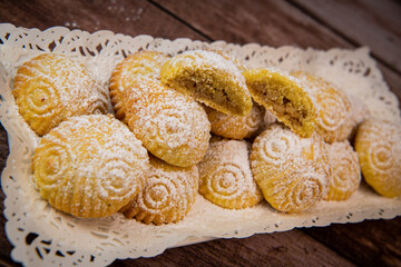 Traditional eid maamoul or mamoul cookies with dates, nuts, and jam, Arabic sweets for Aid al-Fitr and easter, High quality photo