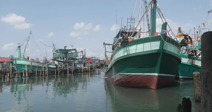 Back View Of The Fishing Boat Leaving From The Fishing Port