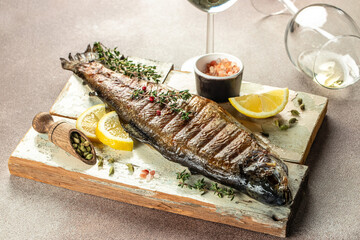 grilled trout with lemon pieces, Food recipe background. Close up