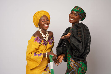 Happy Nigerian women dressed in traditional dress.