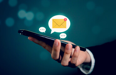 Businessman hand using smartphone and shows a digital screen of new email notifications, messages to deliver.