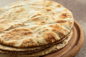 pita bread on a wooden board. Traditional Arabic cuisine. banner, menu, recipe place for text, top view
