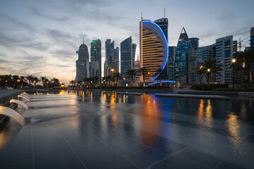 The skyline of the modern and high-rising city of Doha in Qatar, Middle East. - Doha's Corniche in...