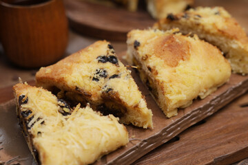 Sweet bread with banana and chocolate filling, topped with chocolate chips, bakery product