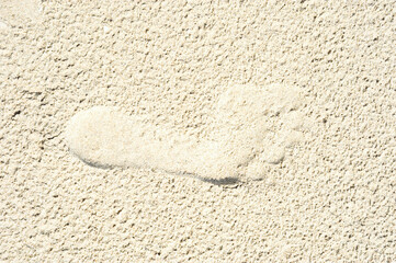 Footprint on sand at the beach background    