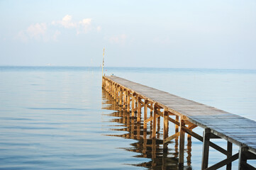 Wooden bridge over the sea. Travel and vacation freedom concept, Thailand
