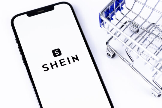 Shein mobile icon app on a smartphone screen iPhone and trolley, shopping cart. Shein - Chinese e-commerce company, online store. Batumi, Georgia - April 5, 2023