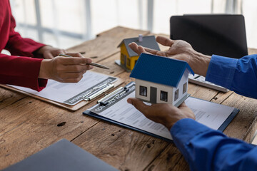 Businessman and Real Estate Broker Marketing planning and discussion at real estate brokerage meetings, business meetings with new startup projects Presentation of concepts, analysis of plans.
