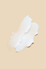 Beauty skincare cream texture swipe swatch. White beauty cream smear smudge isolated on beige background