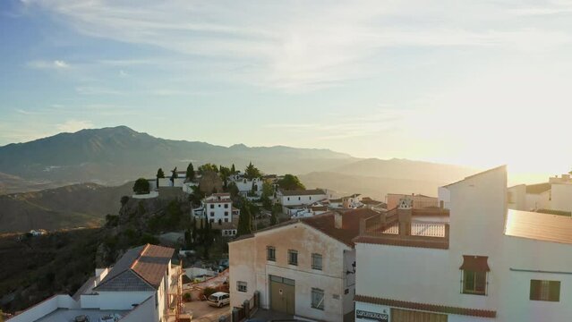 Aerial drone shot of a classic white Andalusian village Comares located on a mountain top near Malaga.