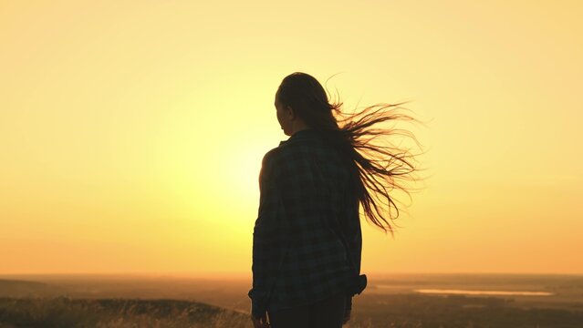 sun girl. happy young woman hands up sunset sky. joy sun. faith religion. journey women freedom. weekend vacation vacation nature. happiness unity nature. hands up sky. sun glare hand. wind hair
