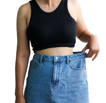 Clean cut clipping path Young Asian woman body showing successful body after losing weight in oversize jeans on white background. Diet and weight loss concept. 