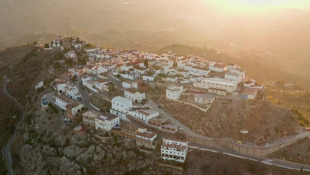 Aerial drone shot of a classic white Andalusian village Comares located on a mountain top near Malaga.