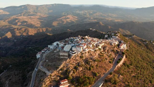 Aerial drone shot of a classic white Andalusian village Comares located on a mountain top near Malaga.