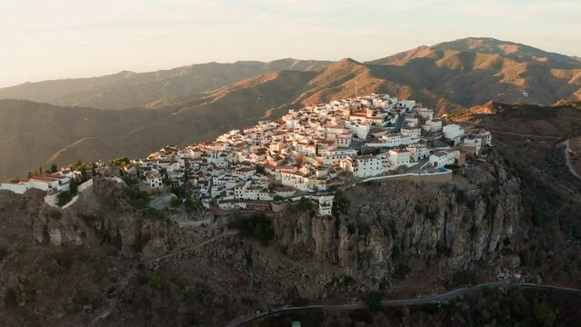 Aerial drone shot of a classic white Andalusian village Comares located on a mountain top near Malaga.