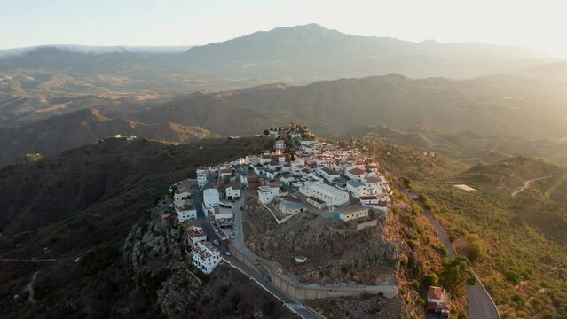 Aerial drone shot of a classic white Andalusian village Comares located on a mountain top near Malaga.