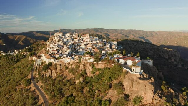 Aerial drone shot of a classic white Andalusian village Comares located on a mountain top near Malaga.