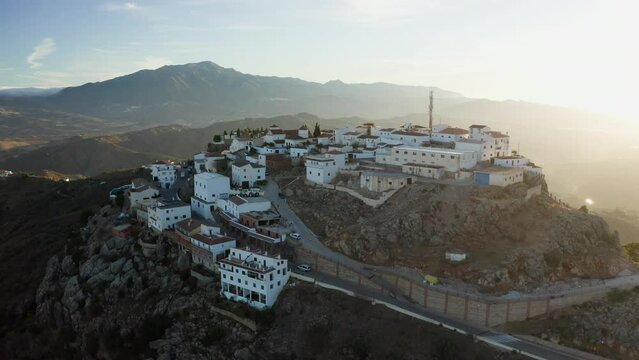 Aerial drone shot of a classic white Andalusian village Comares located on a mountain top near Malaga.
