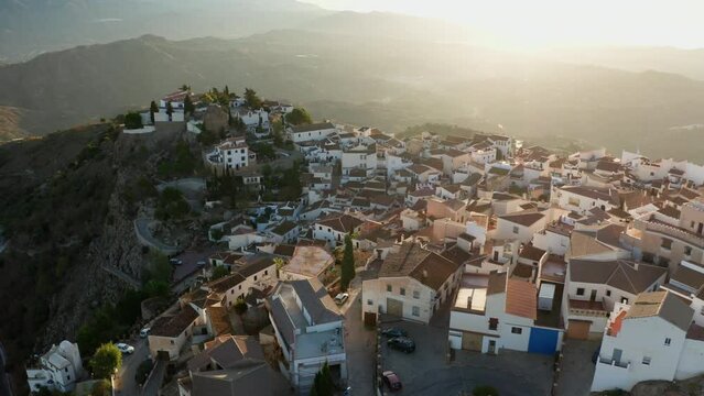 Aerial drone shot of a classic white Andalusian village Comares located on a mountain top near Malaga.
