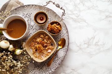 Homemade granola with walnuts and coffee