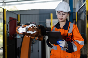 Female technician modern factory, Technical supervisor of robot operation department. Engineer worker use tablet control robotic automatic, Factory Industry automatic system software.