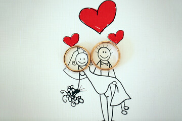 Wedding rings placed on the faces of bride and groom illustration