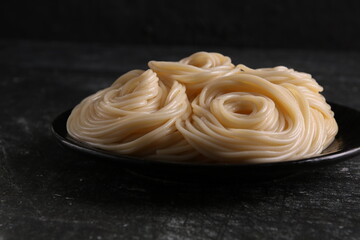 photo of boiled spaghetti lying on a plate
