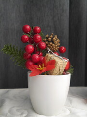 Close-up of Christmas tree decorations, red and gold, perfect for Christmas illustrations.
