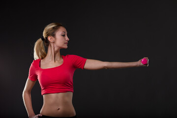 Proud fitness stance, woman with pink weight