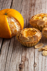 Orange almond pie on wooden table