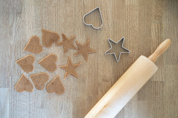 Preparing bakery in kitchen, homemade Christmas ginger bread cookies with rolling pin and kitchen utensil