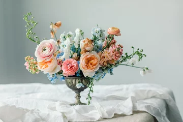 Still life of Flowers bouquet in vintage vase on white linen French tablecloth © AnaGost
