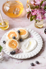 cottage cheese pancakes with honey and sour cream