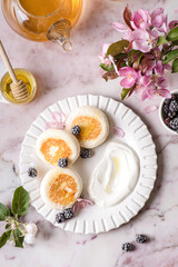 cottage cheese pancakes with honey and sour cream